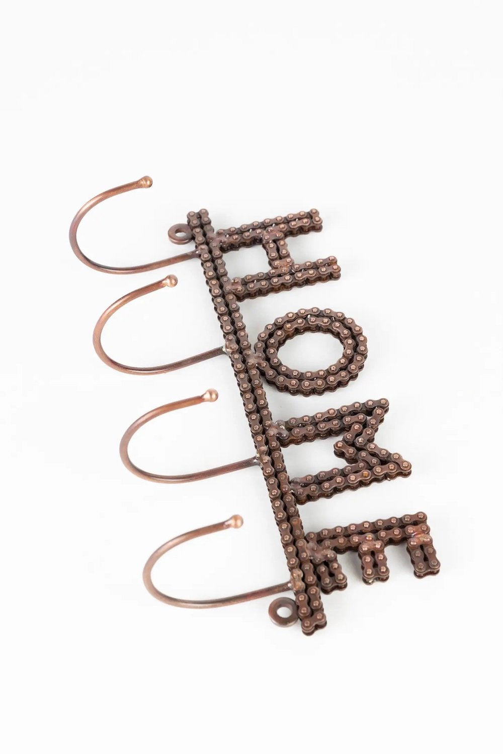 Handcrafted recycled metal wall hook with a "HOME" design - Wall Hooks & Hangers at Better World Bio