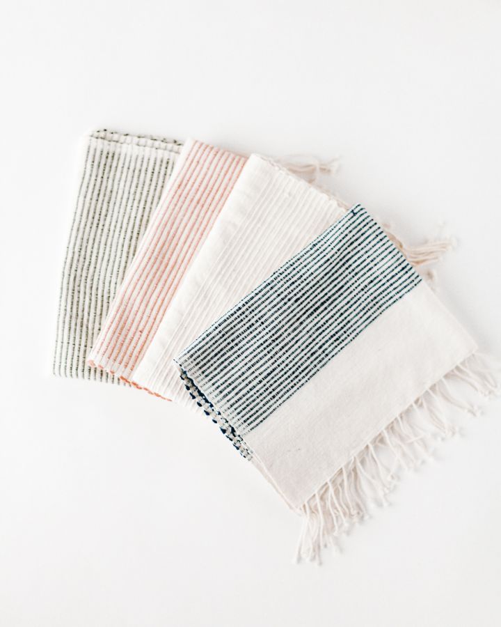 Set of three hand towels in blush and white, gray and white, and navy and white—neatly folded and artisan-crafted for bath or kitchen use.