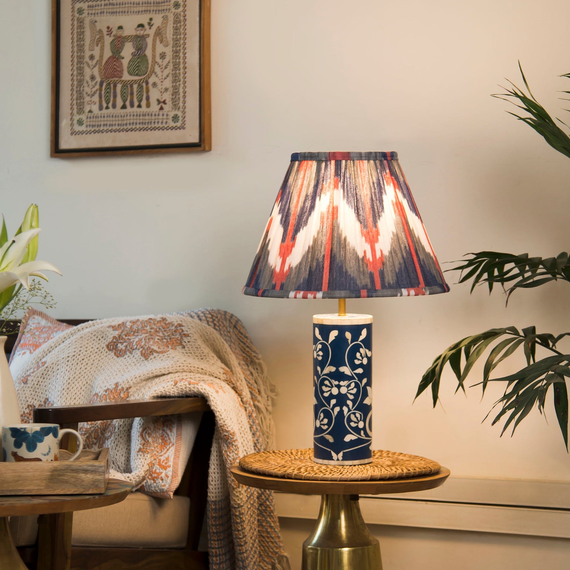 Decorative lamp with a colorful shade on a small table in a cozy living room.