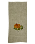 Textured towel with embroidered pumpkin design on a white background