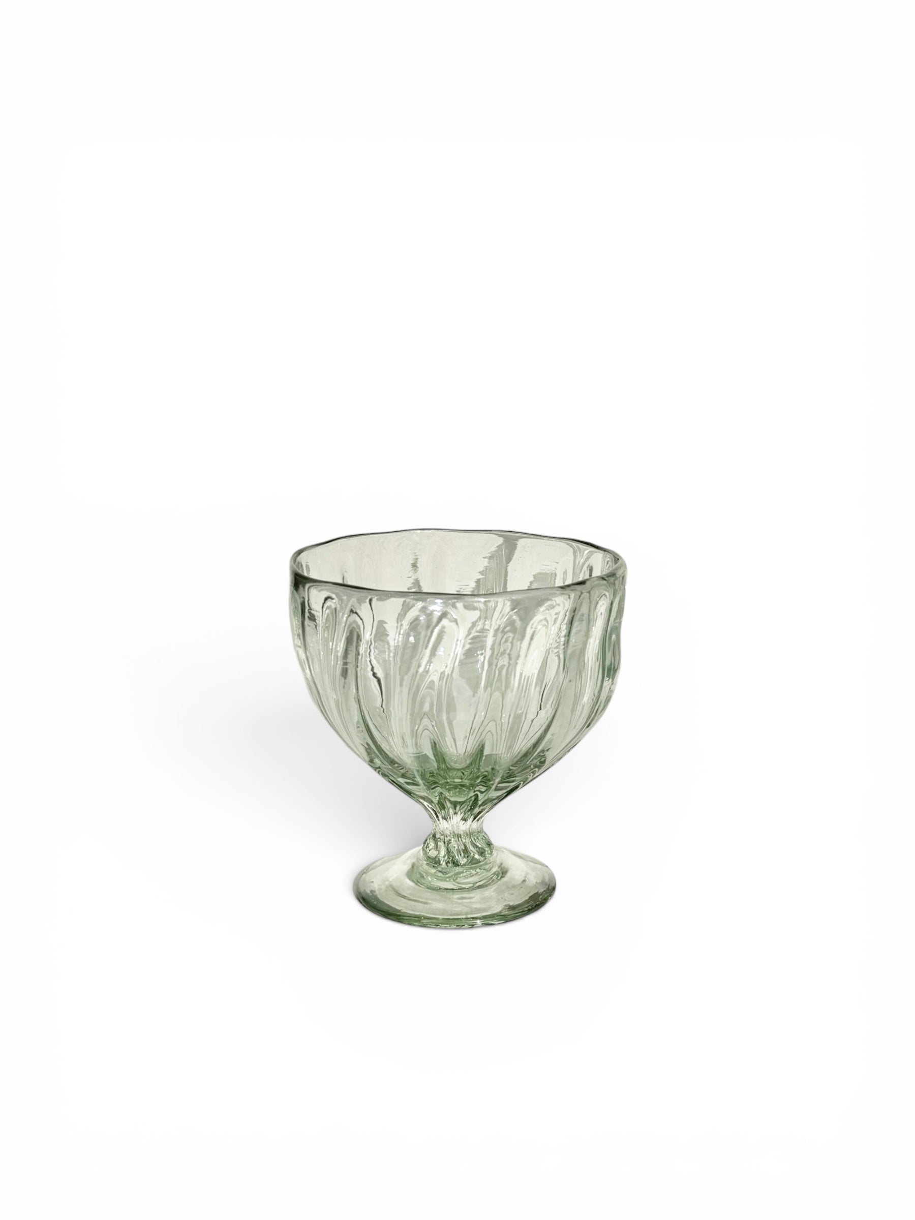 Clear parfait glass goblet on a white background