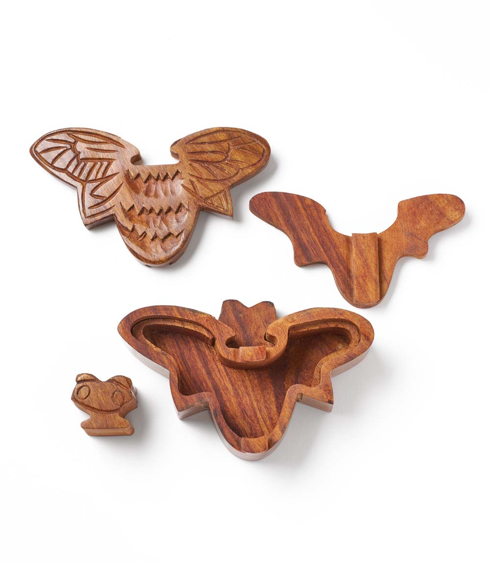 Set of wooden animal-shaped cookie cutters on a white background