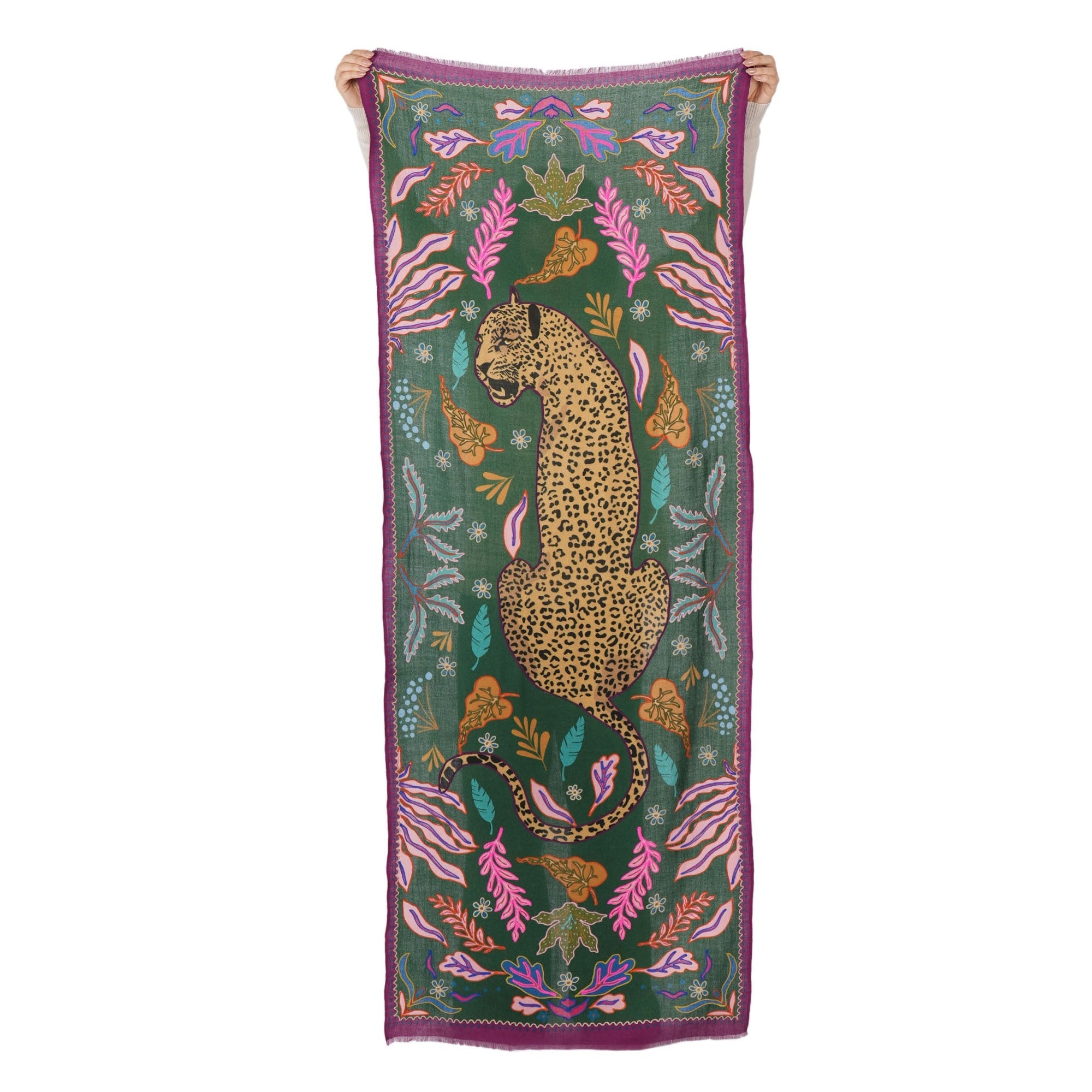 Decorative scarf with a leopard design on a green background