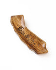 Wooden trinket dish with engraved design on a white background