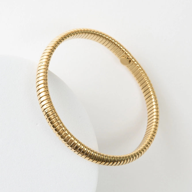 Gold bracelet on a white background