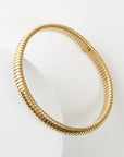Gold bracelet on a white background