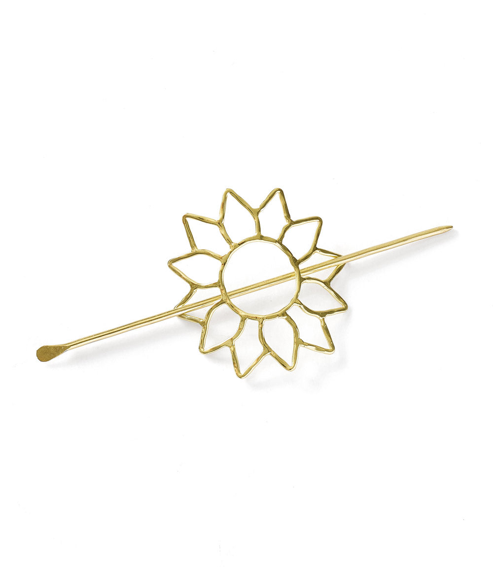 Gold sun hairpin on a white background