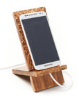 Smartphone on a wooden stand with a white background