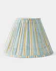 Striped lampshade with green and gold pattern on a white background.