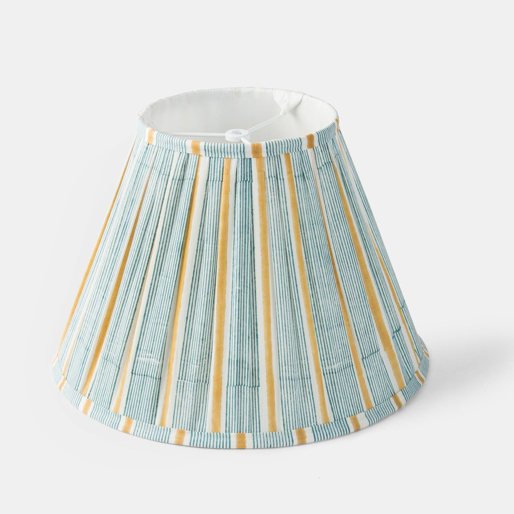 Striped lampshade with green and yellow pattern on a white background.