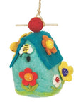 Colorful felt birdhouse with flowers and a bee on a white background
