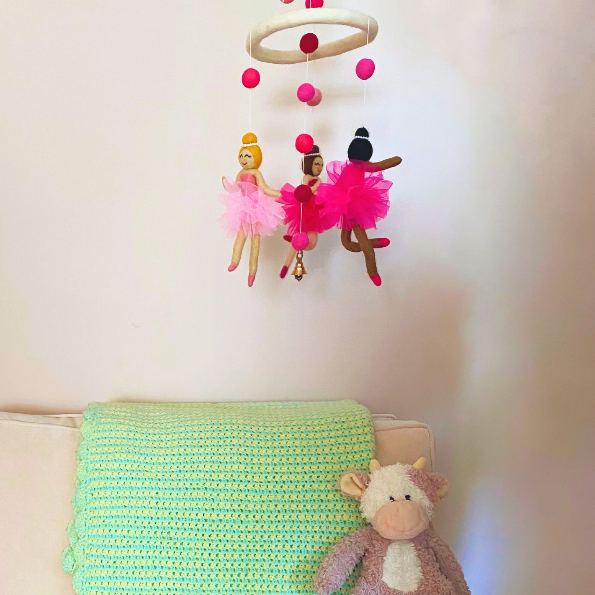 Pink nursery mobile with three ballerina design