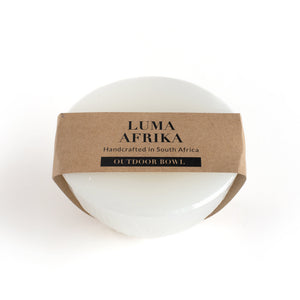 White bowl with a brown label reading 'Luma Afrika' on a white background
