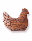 Wooden puzzle shaped like a chicken on a white background