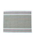 A striped placemat with blue, white, and red colors, handwoven from cotton