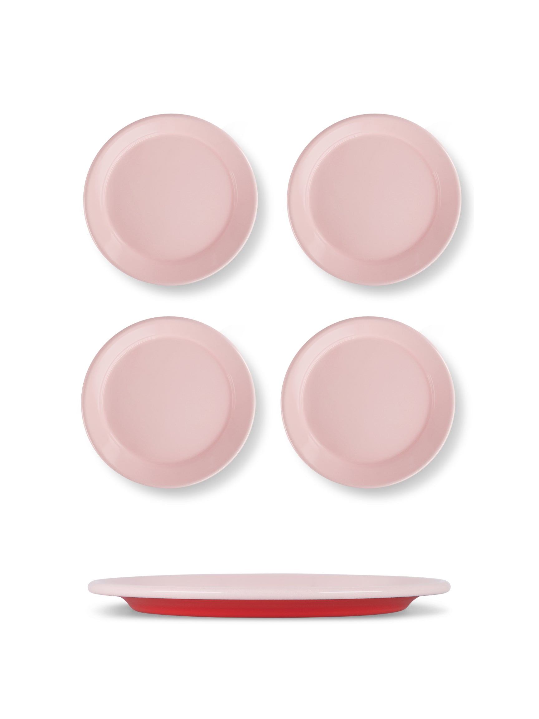 Set of four pink plates with a red rim on a white background