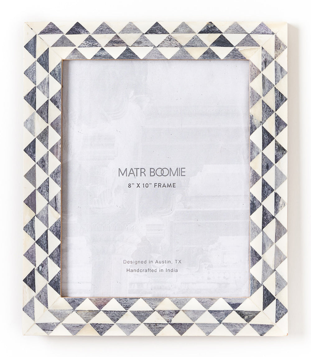 Handcrafted gray and white picture frame with a geometric pattern, brand name Matr Boomie visible on the frame