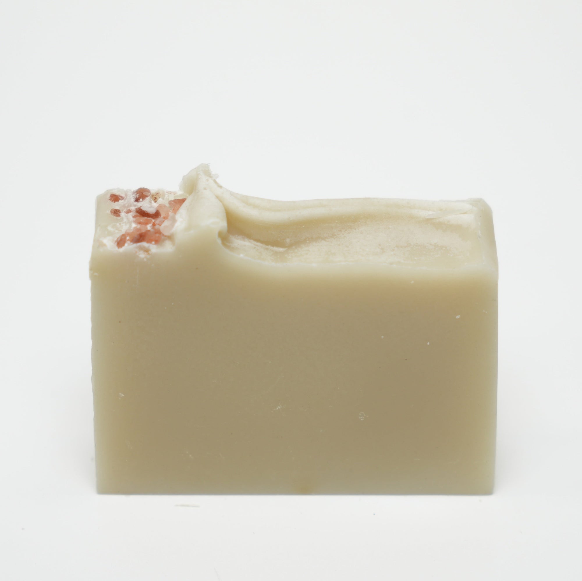 Bar of soap with a textured surface on a white background