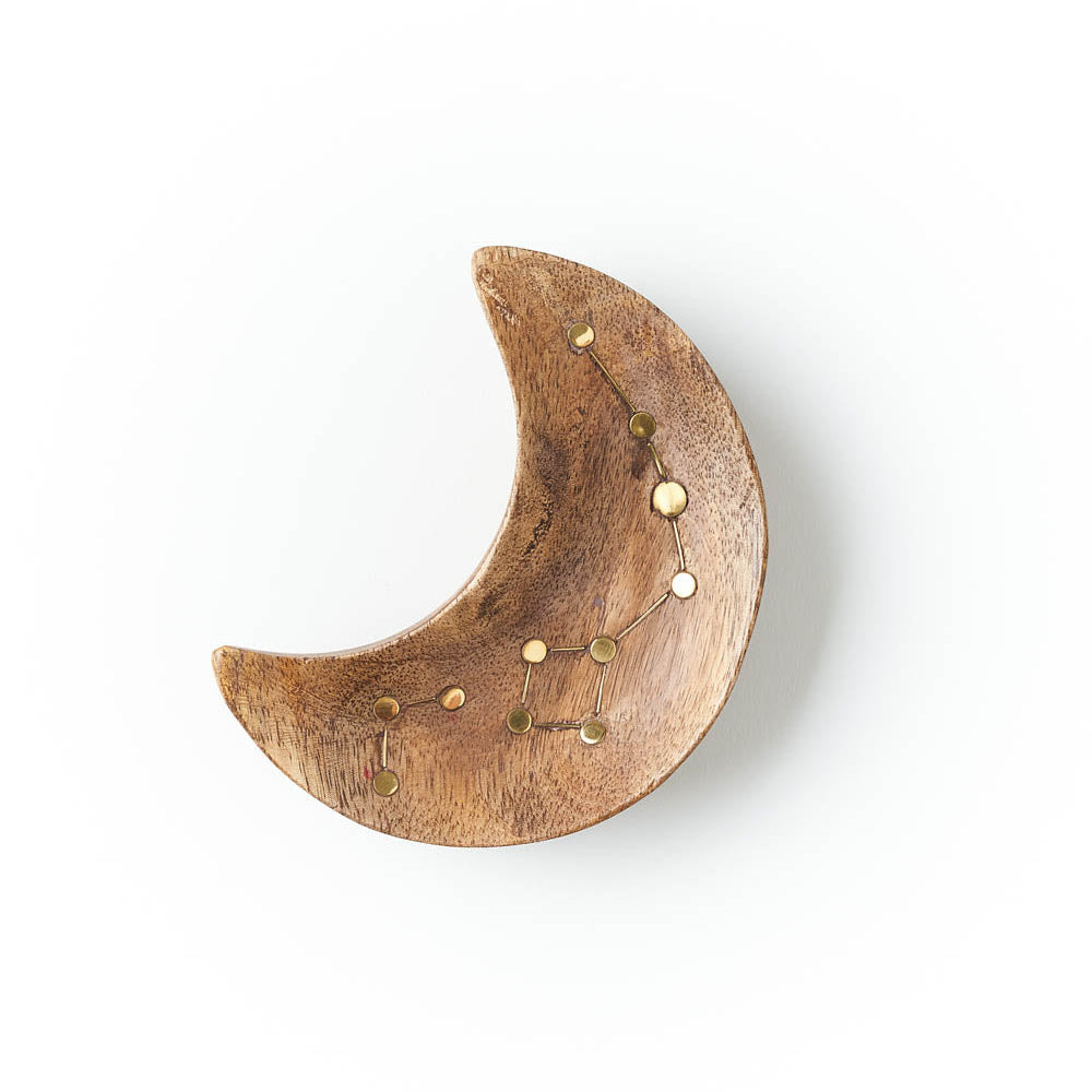 Wooden crescent moon-shaped trinket dish with gold accents on a white background