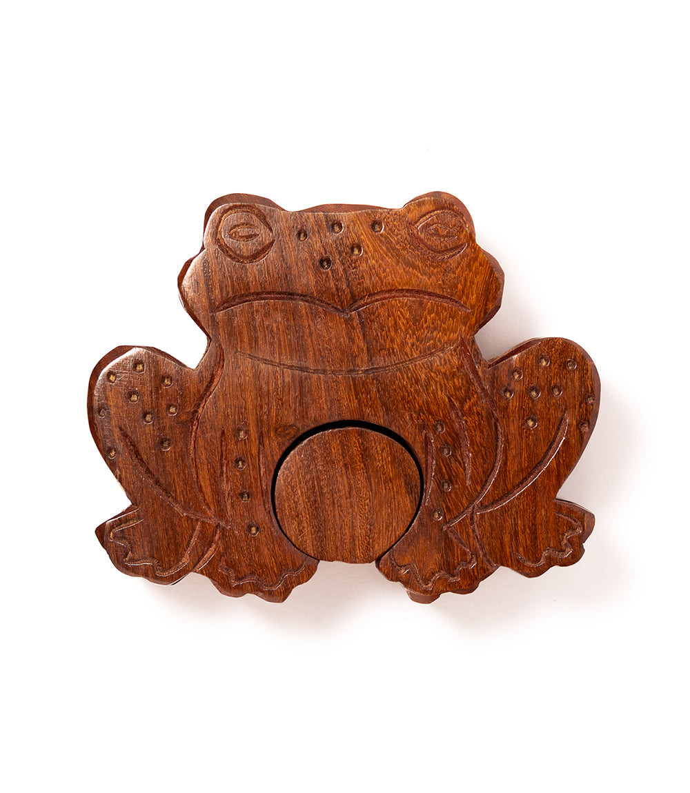 Wooden frog puzzle toy on a white background