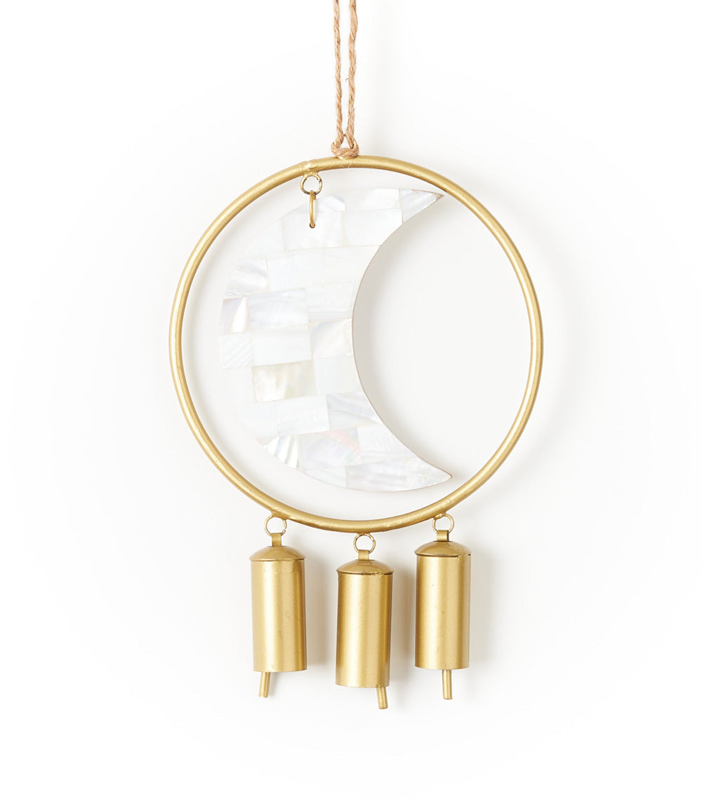 Decorative hanging bell chime with gold metal accents and moon design mother of pearl on a white background