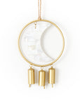 Decorative hanging bell chime with gold metal accents and moon design mother of pearl on a white background