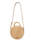 Woven handbag with a strap on a white background