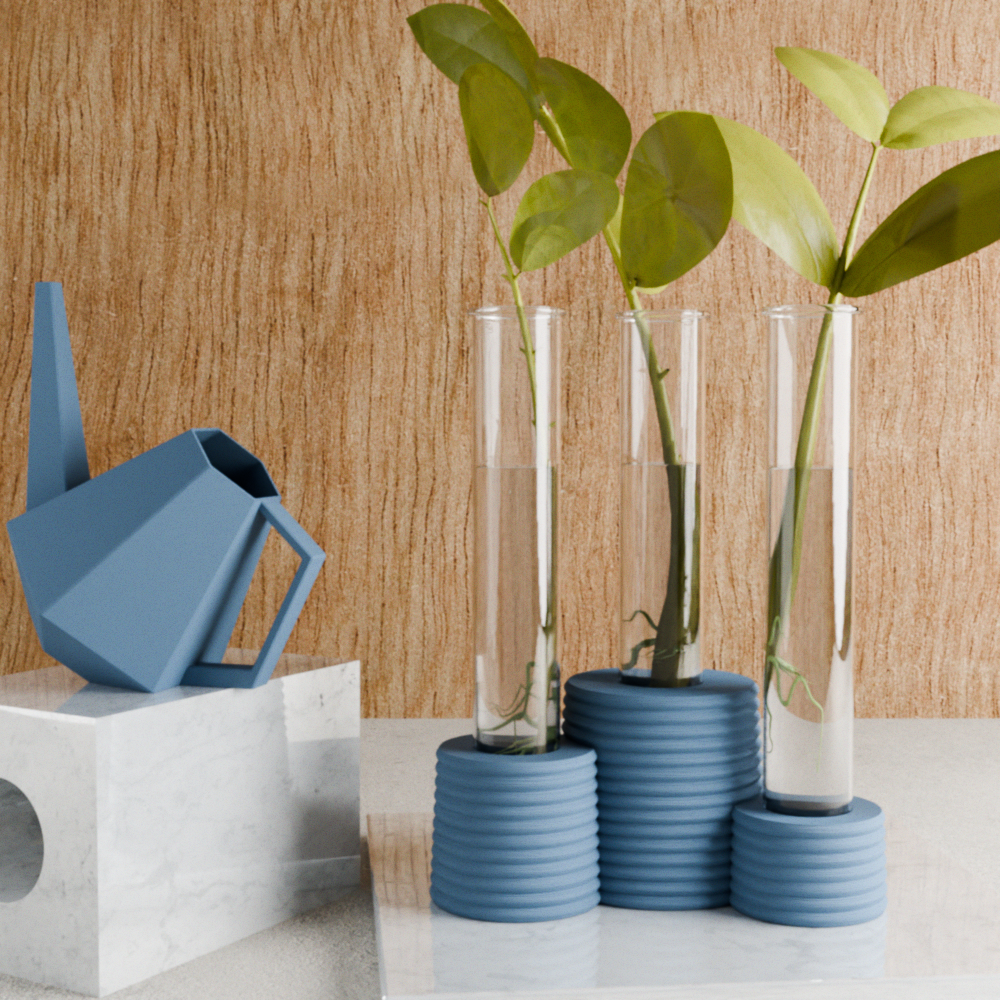 Blue watering can and planters with green plants on a wooden surface