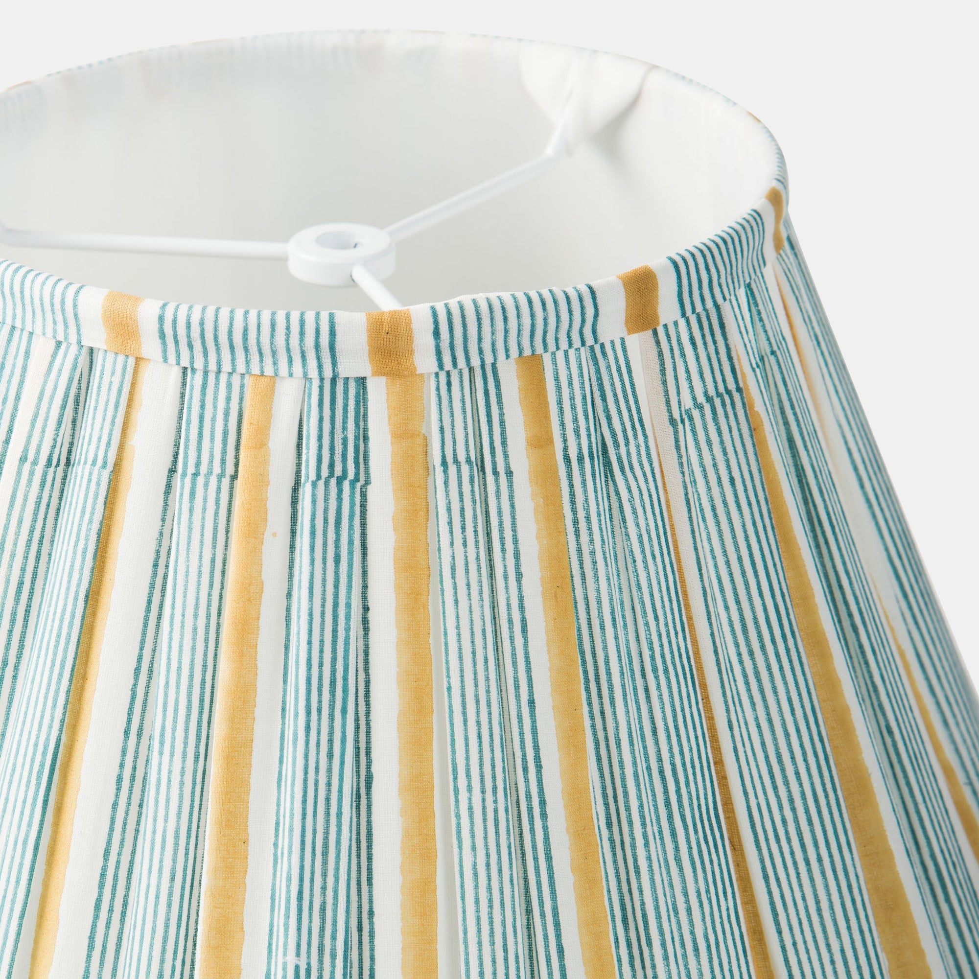 Striped fabric with green and yellow lines on a white background