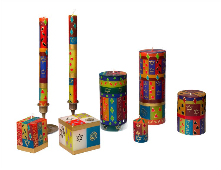 Colorful Hanukkah candles on a white background