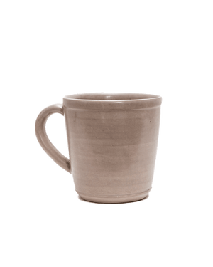 Beige ceramic mug on a white background