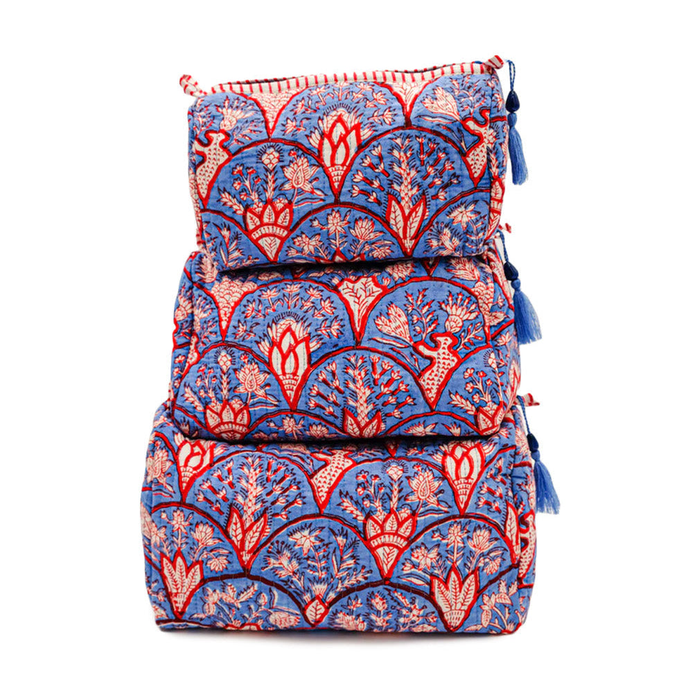 Set of three stacked bags with a blue and red floral pattern on a white background