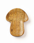 Wooden mushroom-shaped trinket dish on a white background