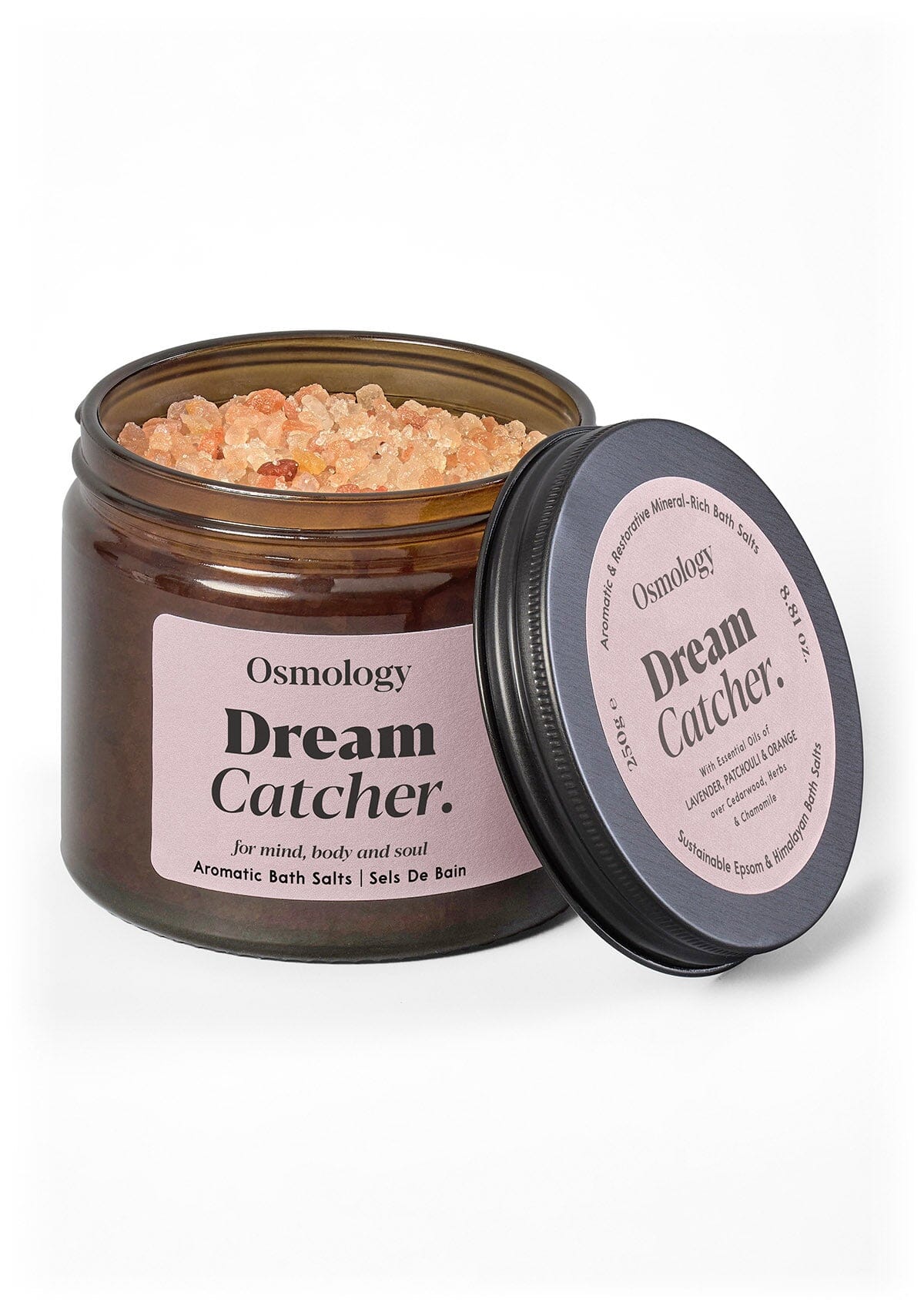 Osmology Dream Catcher bath salts jar with pink bath salts and pink label on a white background