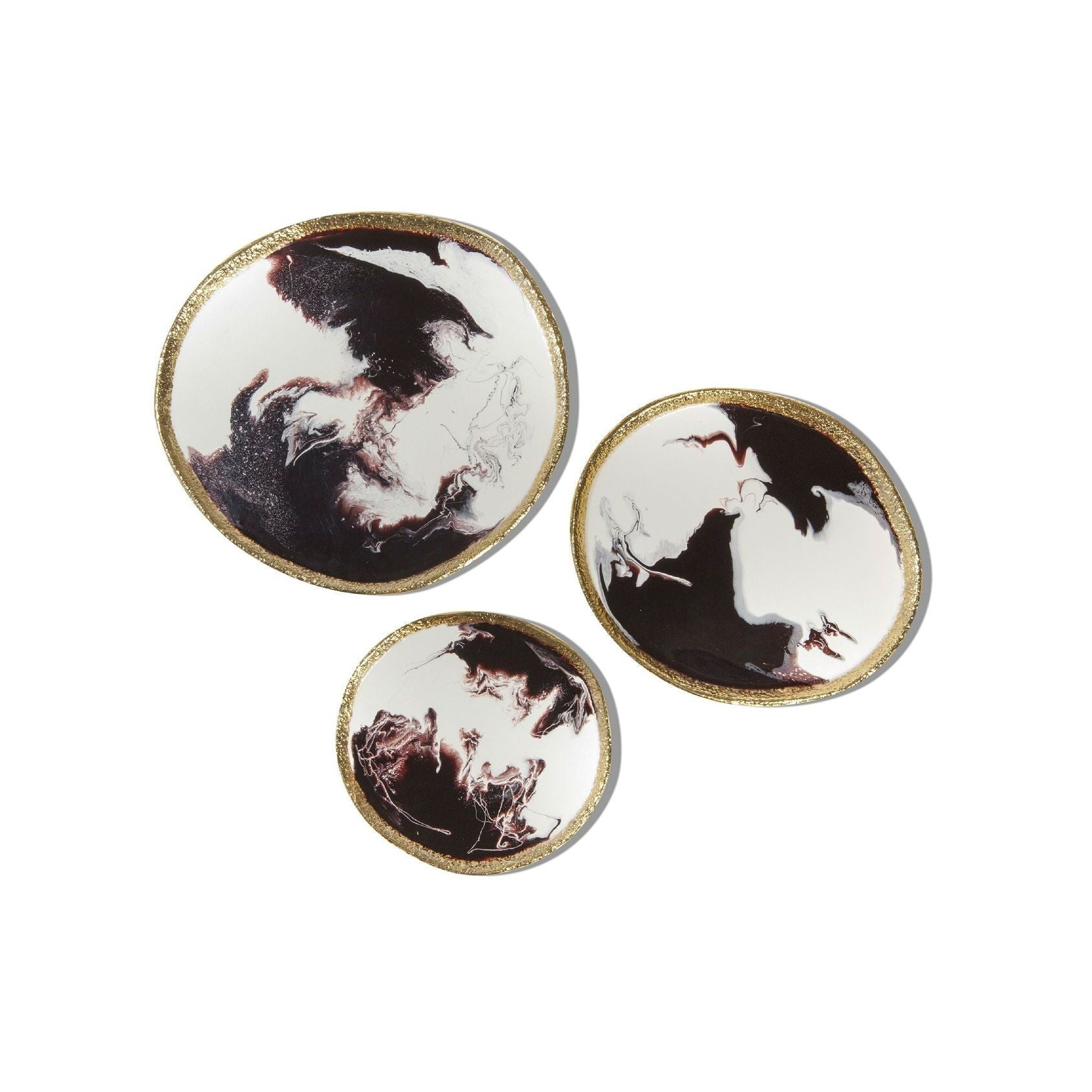 Three circular coasters with artistic designs on a white background