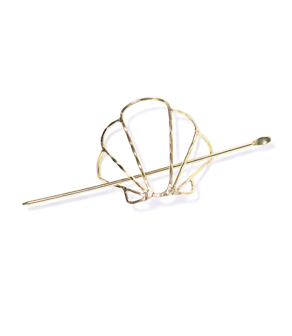 Gold shell design hairpin on a white background