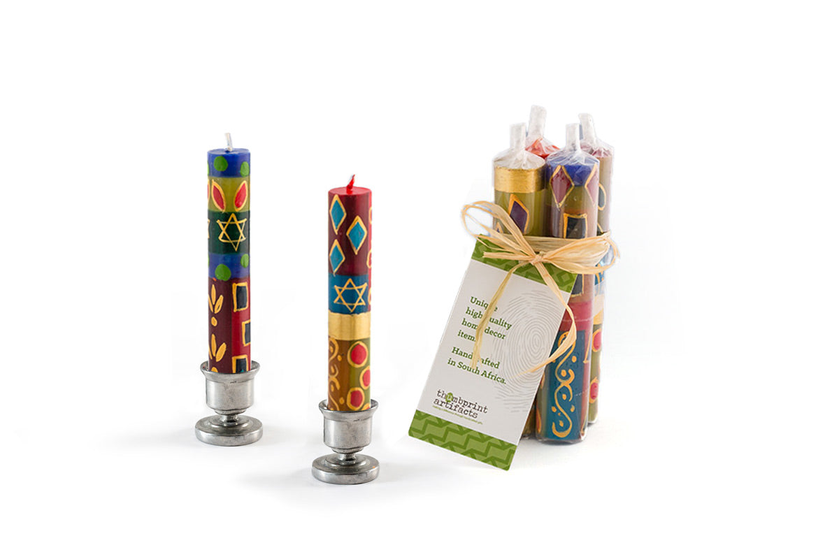 Set of colorful candles with a Star of David design on a white background