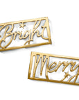 Gold decorative trivets with 'Bright' and 'Merry' text on a white background