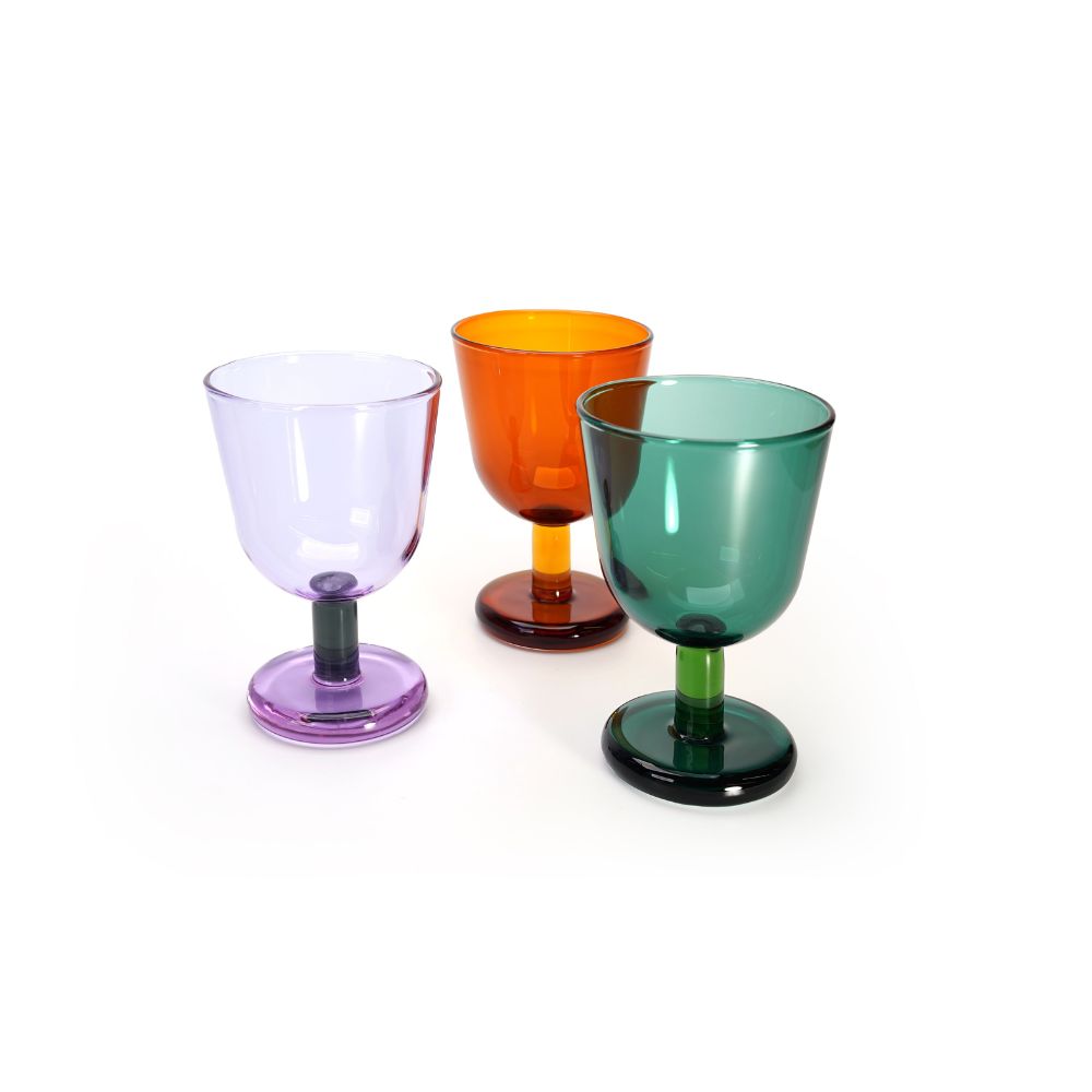 Three colorful glass goblets on a white background