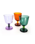Three colorful glass goblets on a white background