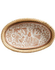 Decorative bread warmer and stone with animal and floral design on a white background