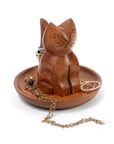 A carved wooden cat-shaped jewelry organizer and tray, shown on a white background with gold-toned jewelry displayed on top.