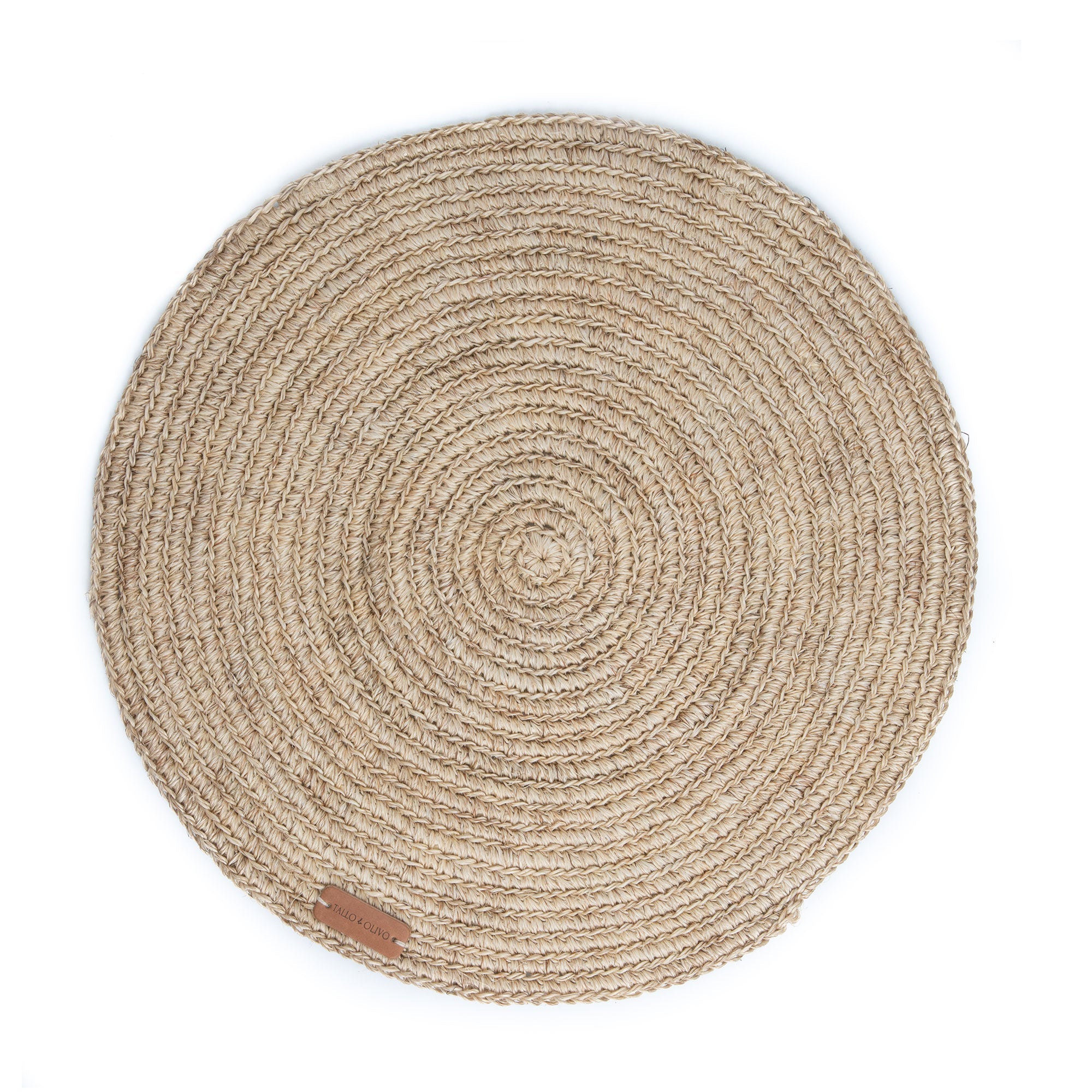 A round placemat made of fique displayed against a white background