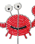 Decorative crab stake made of red beads on a white background