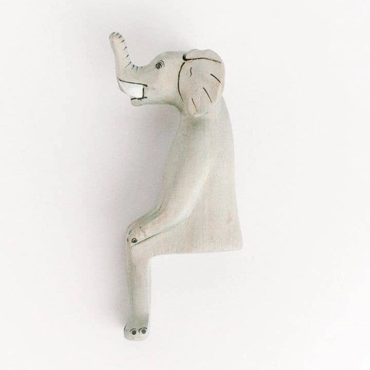 Decorative elephant shelf sitter on a white background