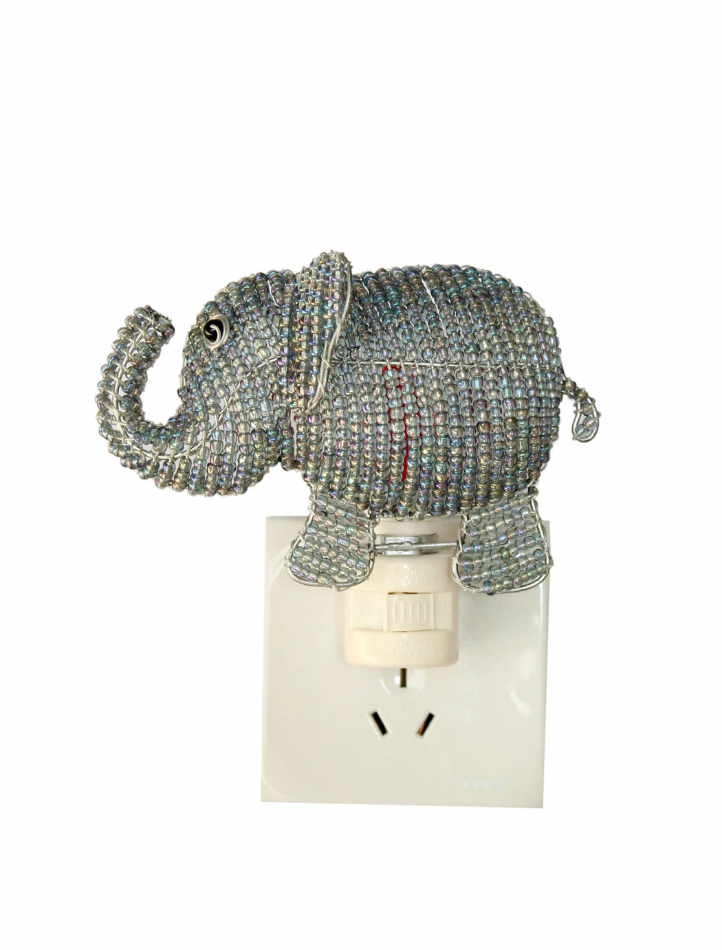 Decorative elephant night light on a white background