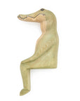 Wooden alligator figurine toy a white background