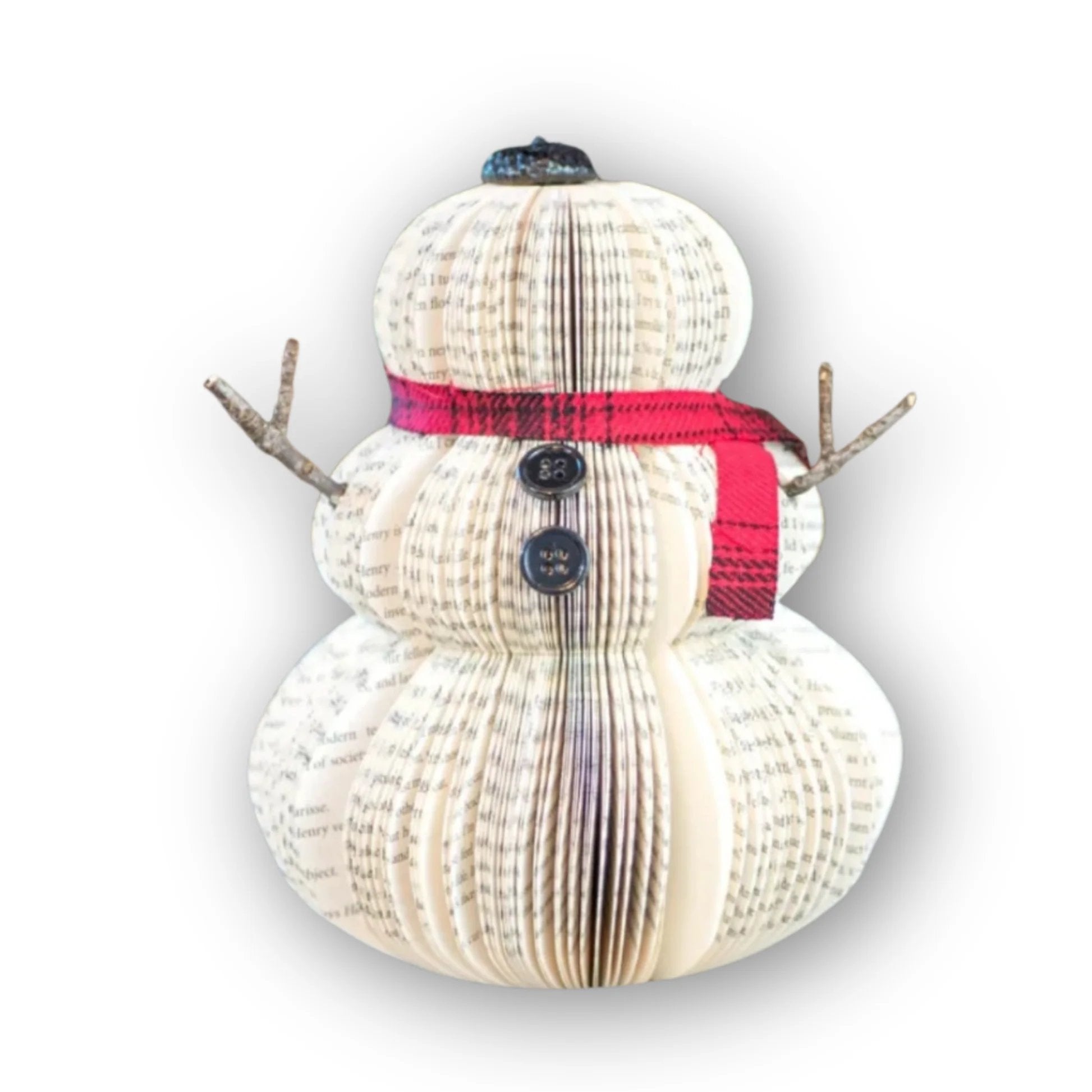 Large snowman made of repurposed paper and wooden arms displayed against a white background