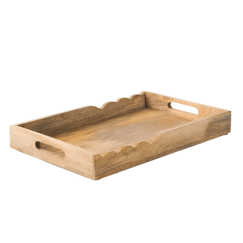Wooden tray with scalloped edges on a white background