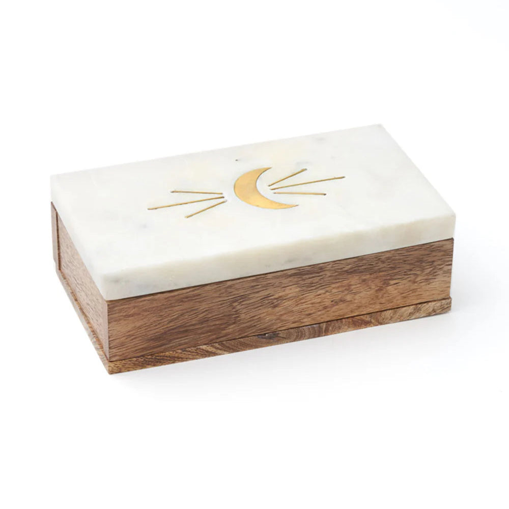 Wooden box with a white top and gold crescent moon design on a white background